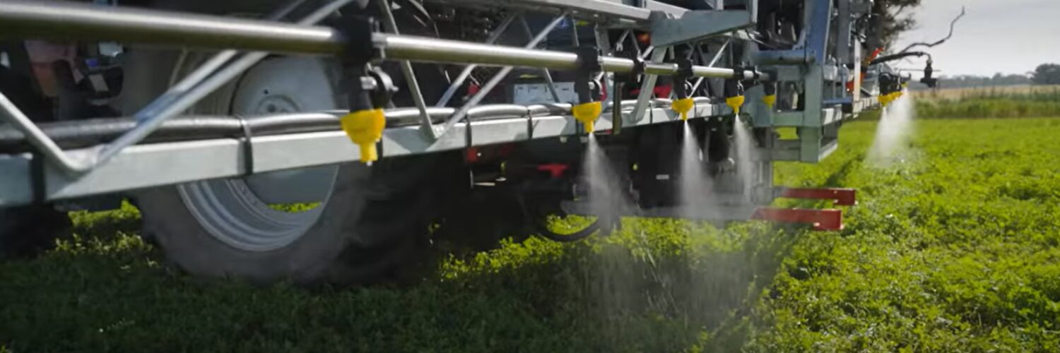 CSS Nozzles Landing Page Header Croplands Spray nozzles in action on the back of a sprayer. unit