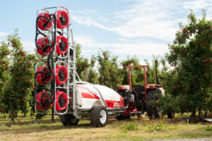 Croplands Quantum Mist Orchard Sprayer being towed by a tractor