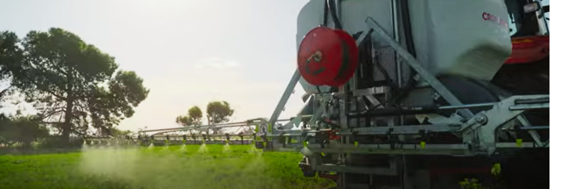 Croplands_1300_Linkage PRO Page Header Croplands Agripak 1300 Pro Linkage sprayer showing boom and nozzles with spray coming out