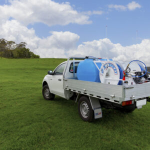 A ute with a Quik Spray twin hose reel sprayer on the back tray.